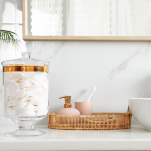 Bathroom counter organization -Masson jar and baskets used to house toiletries