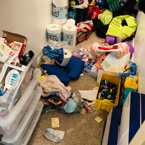 Causes of Cluttering at Home -A cluttered room with items everywhere on the floor