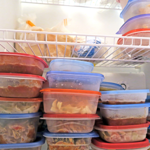 How to Clean Your Freezer - Frozen food in airtight containers in a freezer
